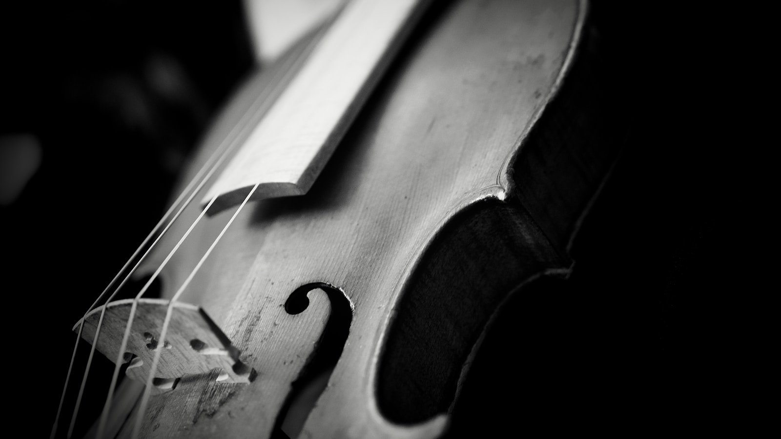 Close-up of a vintage violin on a dark background